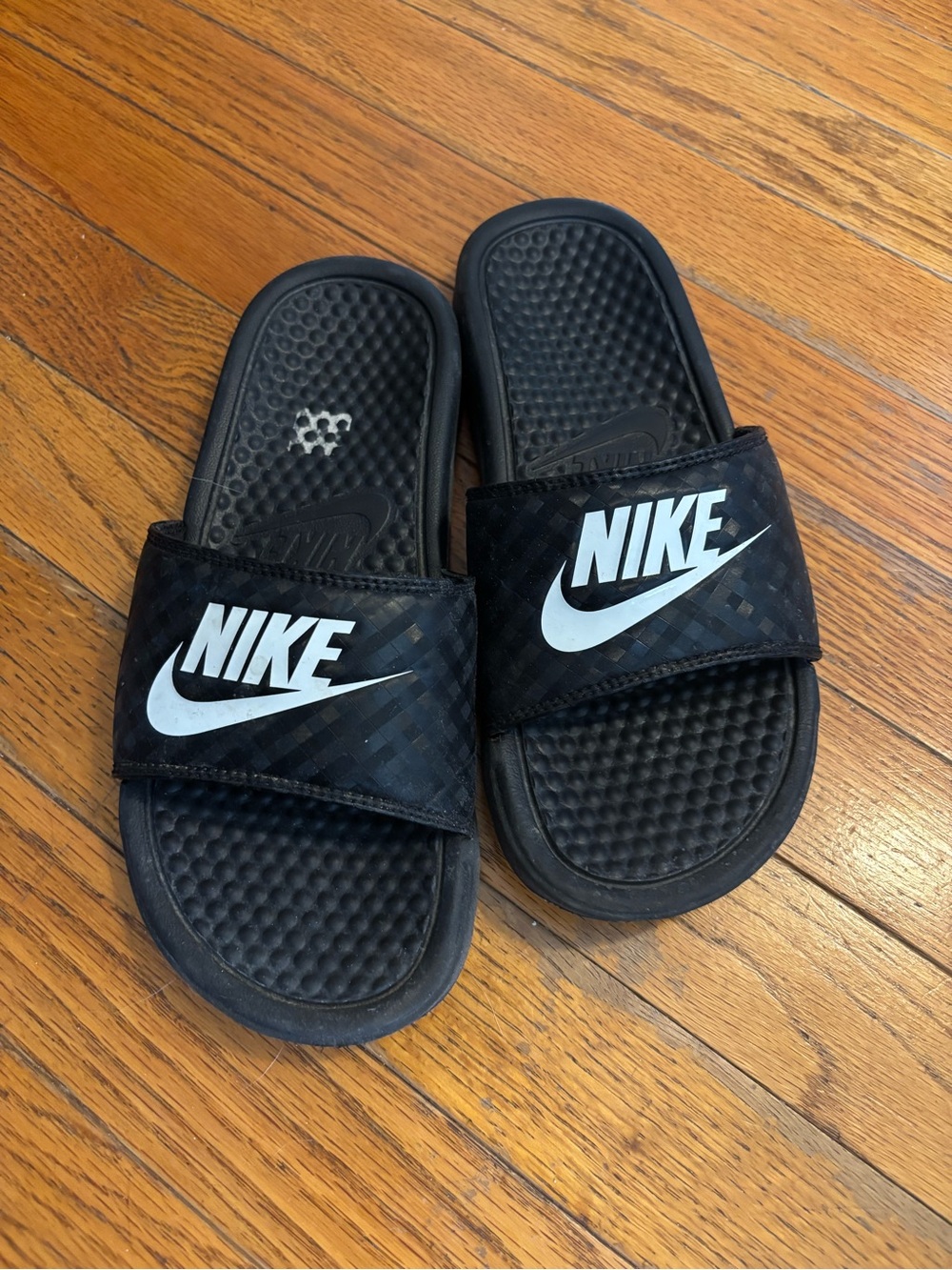 Nike Women’s Black Slip On Slide Sandals with White Logo